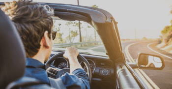 Triple Seven Corfu Car Rental close up picture of man driving a car