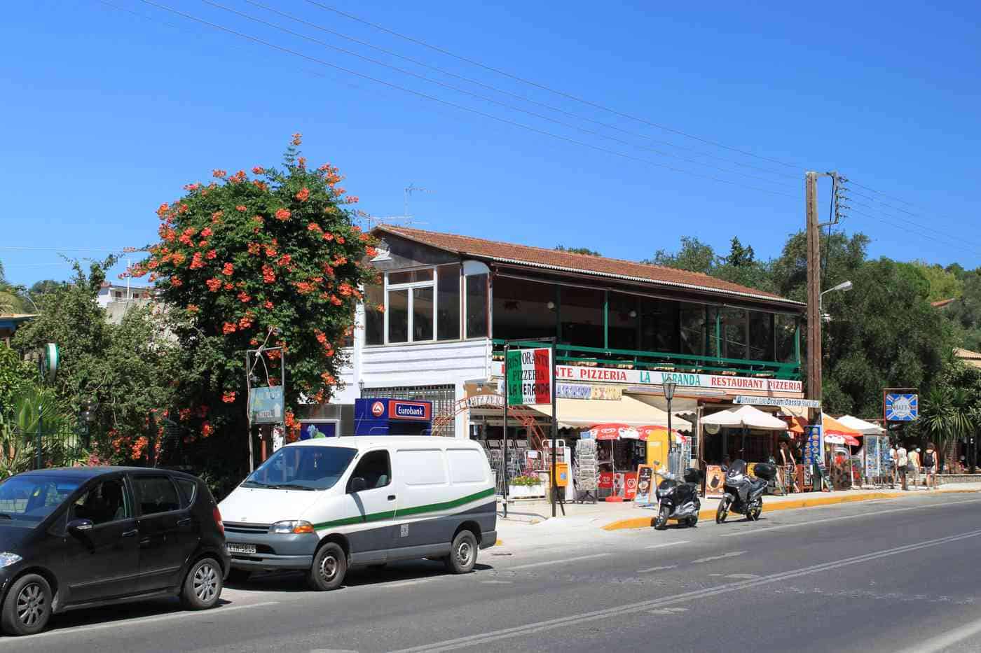 Dassia Car Rental Corfu — the resort road through Dassia