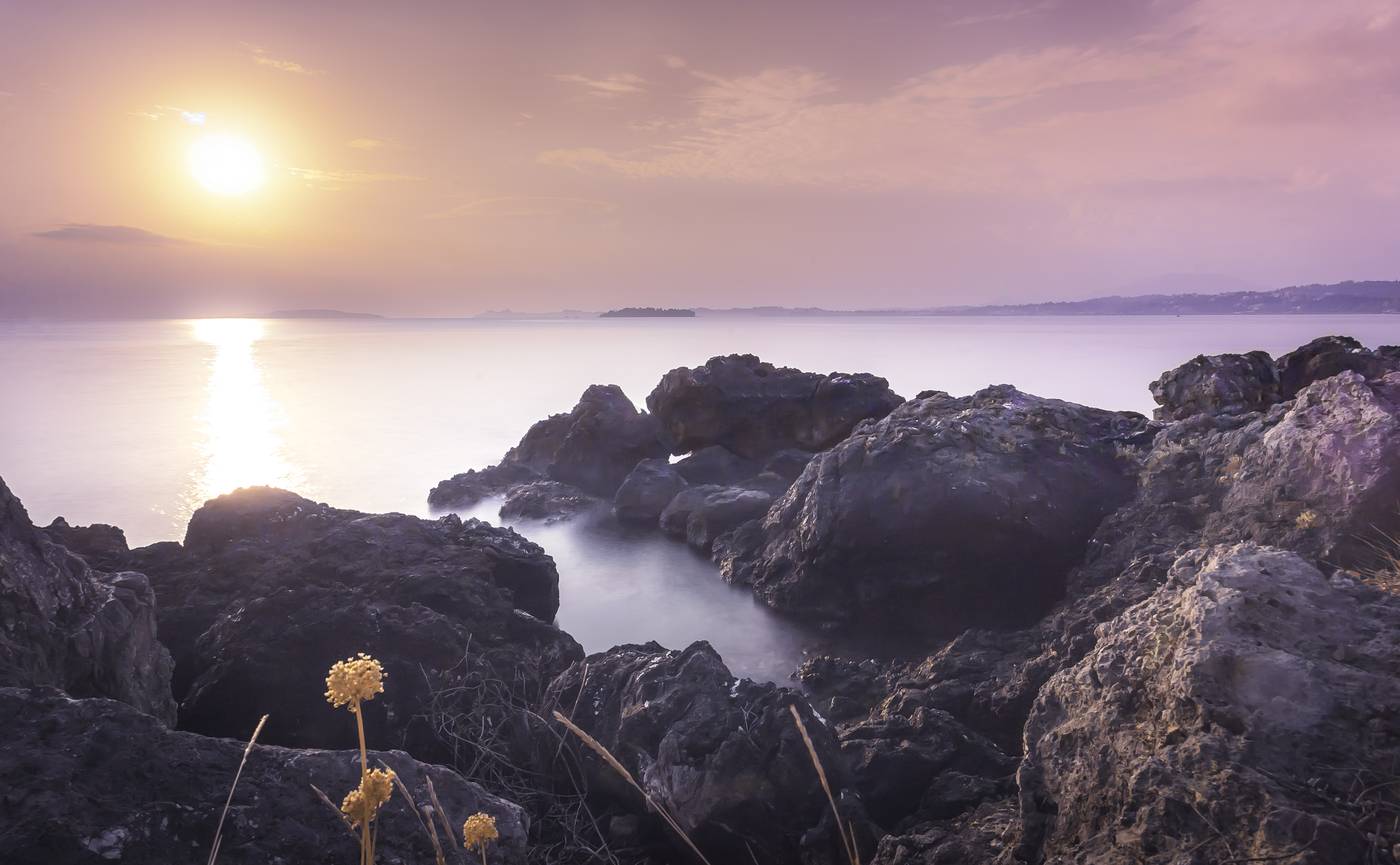 Kommeno Car Rental Corfu — the rocky shore of the Kommeno peninsula